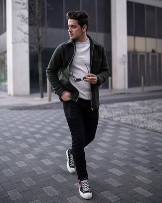 Dark Green Harrington Jacket Outfits: Uber stylish and functional, this off-duty combination of a dark green harrington jacket and black skinny jeans will provide you with variety. A pair of black print canvas low top sneakers integrates seamlessly within a variety of combos.