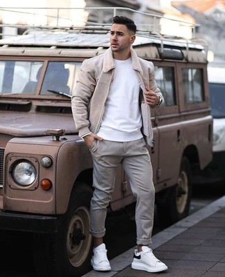 Beige Harrington Jacket Outfits: Extremely stylish, this laid-back combination of a beige harrington jacket and grey chinos provides with amazing styling possibilities. Complete this getup with a pair of white and black leather low top sneakers to avoid looking too polished.