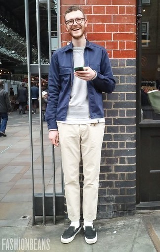 Black Canvas Slip-on Sneakers Outfits For Men: This combo of a navy harrington jacket and beige chinos is super easy to imitate and so comfortable to wear a variation of as well! Let your outfit coordination credentials really shine by finishing this ensemble with a pair of black canvas slip-on sneakers.