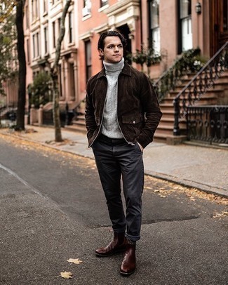 Charcoal Knit Turtleneck Outfits For Men: For a goofproof laid-back option, you can't go wrong with this pairing of a charcoal knit turtleneck and charcoal chinos. Finishing off with a pair of dark brown leather chelsea boots is an effective way to infuse a dash of polish into this outfit.