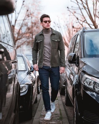 Dark Brown Turtleneck Outfits For Men: To put together a casual getup with a modern take, pair a dark brown turtleneck with navy jeans. The whole outfit comes together brilliantly when you throw white canvas low top sneakers into the mix.