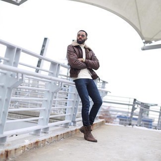 White Wool Turtleneck Outfits For Men: A white wool turtleneck and navy jeans paired together are the perfect combination for men who prefer laid-back and cool styles. Brown suede casual boots are a surefire way to bring an added touch of class to your outfit.