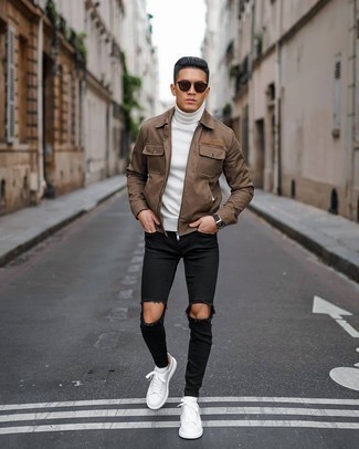 White Turtleneck Outfits For Men: Infuse style into your current outfit choices with a white turtleneck and black ripped skinny jeans. A pair of white leather low top sneakers easily revs up the fashion factor of your outfit.