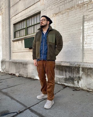 Olive Fleece Zip Sweater Outfits For Men: This casual combination of an olive fleece zip sweater and brown corduroy chinos can go in different directions depending on the way it's styled. Beige athletic shoes add a more dressed-down aesthetic to the getup.