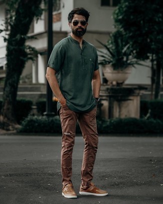 Tan Leather Low Top Sneakers Outfits For Men: For comfort dressing with a clear fashion twist, wear a dark green henley shirt and brown chinos. When it comes to shoes, this ensemble pairs perfectly with tan leather low top sneakers.