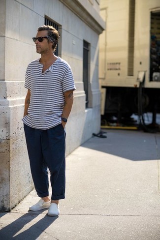 White and Navy Horizontal Striped Henley Shirt Outfits For Men: To achieve a laid-back ensemble with a twist, wear a white and navy horizontal striped henley shirt with navy chinos. A good pair of white canvas slip-on sneakers is an easy way to bring a sense of sophistication to your ensemble.