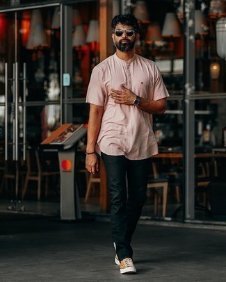 Tobacco Canvas Low Top Sneakers Outfits For Men: Look casually stylish without really trying by wearing a pink henley shirt and black jeans. Let your styling savvy really shine by complementing this ensemble with a pair of tobacco canvas low top sneakers.