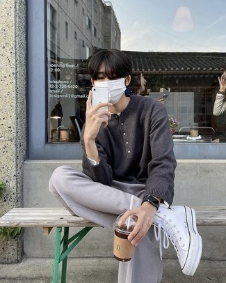 Henley Sweater Outfits: A henley sweater and grey chinos are the kind of a tested off-duty combination that you so terribly need when you have no extra time. Go for a pair of white canvas high top sneakers to infuse a sense of stylish nonchalance into this getup.