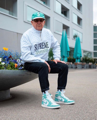 Men's Green Baseball Cap, White and Green Leather High Top Sneakers, Black Jeans, White Zip Neck Sweater