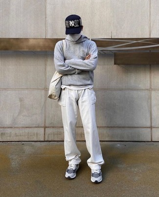 White Cargo Pants Outfits: If you're facing a fashion situation where comfort is above all, this combination of a grey hoodie and white cargo pants is a winner. Amp up your whole outfit with a pair of charcoal athletic shoes.