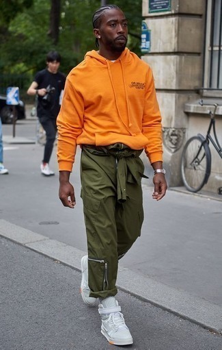 Olive Cargo Pants Outfits: An orange hoodie and olive cargo pants worn together are a savvy match. Add a pair of mint canvas high top sneakers to the mix and the whole look will come together.