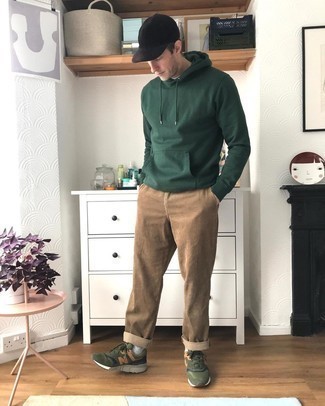 Black Baseball Cap Outfits For Men: A well put together casual pairing of a dark green hoodie and a black baseball cap will set you apart instantly. Wondering how to complete your look? Finish off with olive athletic shoes to spruce it up.