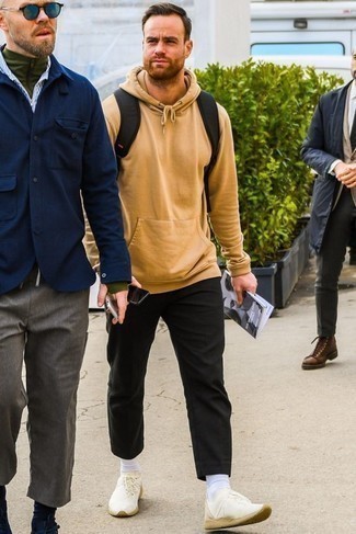 Beige Hoodie Outfits For Men: This combo of a beige hoodie and black chinos provides comfort and functionality and helps you keep it low-key yet current. Infuse an air of stylish nonchalance into your ensemble by finishing off with beige athletic shoes.