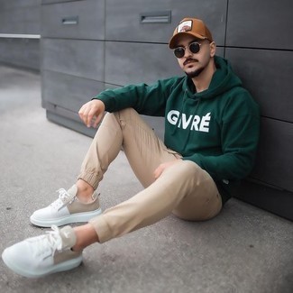 Brown Print Baseball Cap Outfits For Men: A dark green print hoodie and a brown print baseball cap are a smart ensemble to have in your casual lineup. And if you wish to immediately step up this ensemble with a pair of shoes, round off with a pair of white canvas low top sneakers.