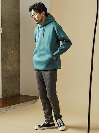 Teal Hoodie Outfits For Men: A teal hoodie looks especially good when matched with charcoal wool chinos in a relaxed casual outfit. Complement your ensemble with a pair of black and white canvas low top sneakers et voila, the ensemble is complete.