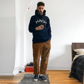 Navy Print Hoodie Outfits For Men: A navy print hoodie and brown corduroy chinos are wonderful menswear must-haves that will integrate nicely within your current styling routine. Look at how nice this ensemble goes with navy canvas low top sneakers.