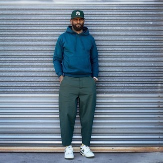 Dark Green Chinos Outfits: A teal hoodie and dark green chinos are the perfect way to infuse effortless cool into your daily casual collection. A pair of white and green leather low top sneakers will be a welcome addition for this look.