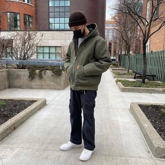 Dark Brown Beanie Outfits For Men: This pairing of an olive hoodie and a dark brown beanie is hard proof that a safe casual ensemble doesn't have to be boring. If you want to feel a bit smarter now, complete this getup with a pair of white leather low top sneakers.