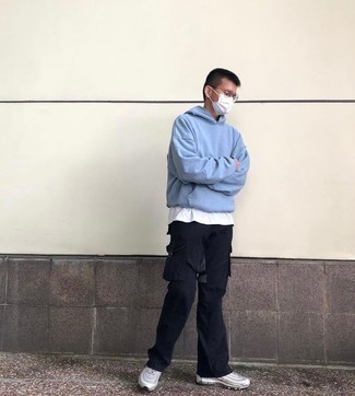 Cargo Pants Outfits: Team a light blue hoodie with cargo pants for an urban getup that's also easy to wear. In the shoe department, go for something on the laid-back end of the spectrum with silver athletic shoes.