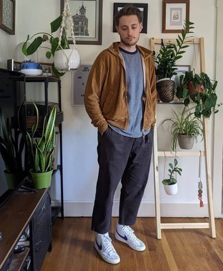 White and Navy Leather High Top Sneakers Outfits For Men: If you're in search of an off-duty and at the same time stylish getup, marry a brown hoodie with black chinos. To give your overall ensemble a more casual aesthetic, complement this look with a pair of white and navy leather high top sneakers.