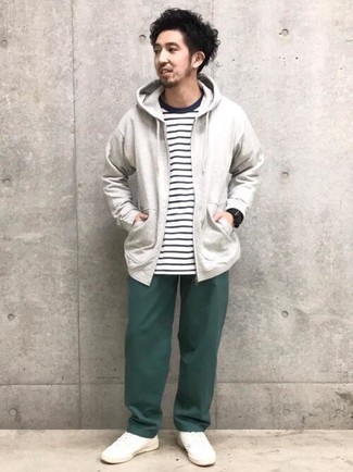 Dark Green Chinos Casual Warm Weather Outfits: This combination of a grey hoodie and dark green chinos makes for the perfect base for a casual and cool ensemble. Complement your ensemble with a pair of white canvas low top sneakers and you're all set looking killer.