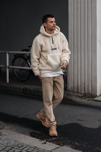 Beige Fleece Hoodie Outfits For Men: This combination of a beige fleece hoodie and khaki corduroy chinos is the perfect balance between fun and dapper. A nice pair of tan athletic shoes is an effortless way to bring a hint of stylish nonchalance to your getup.