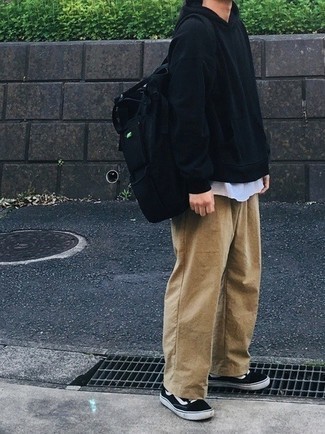 Black Canvas Backpack Outfits For Men: If you're after a street style but also sharp look, try pairing a black hoodie with a black canvas backpack. You can get a bit experimental on the shoe front and introduce a pair of black and white canvas low top sneakers to your ensemble.