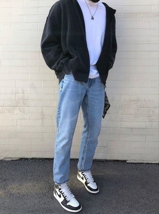 White and Black Leather High Top Sneakers Outfits For Men: If you're hunting for a relaxed casual yet sharp ensemble, reach for a black hoodie and light blue jeans. Add white and black leather high top sneakers to this look to inject a dash of stylish nonchalance into your outfit.