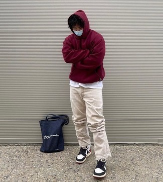 Burgundy Hoodie Outfits For Men: Consider teaming a burgundy hoodie with beige jeans for a laid-back and trendy look. Complement this ensemble with a pair of white and black leather low top sneakers and ta-da: the look is complete.