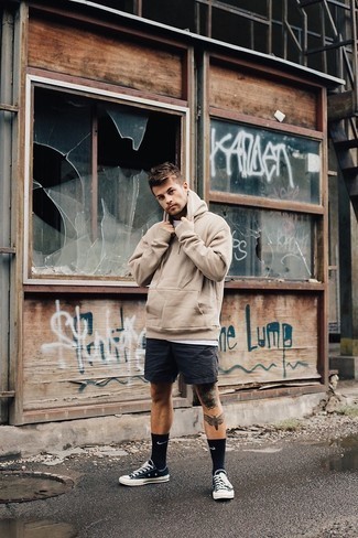 Tan Hoodie Outfits For Men: Flaunt that you know a thing or two about men's style in a tan hoodie and black shorts. Our favorite of a great number of ways to complement this look is with black and white canvas low top sneakers.