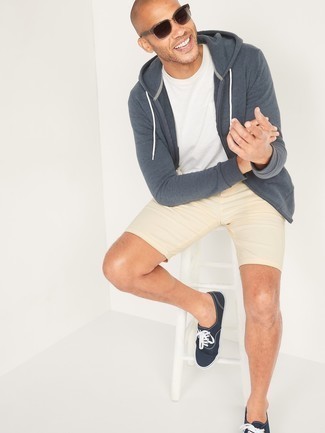 Navy Hoodie Outfits For Men: Wear a navy hoodie with beige shorts for a simple menswear style that's also pieced together nicely. Add a pair of navy and white canvas low top sneakers to the equation and ta-da: this ensemble is complete.