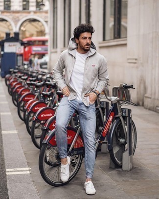 Grey Hoodie Outfits For Men: When the situation permits casual street dressing, wear a grey hoodie and light blue skinny jeans. You could perhaps get a little creative when it comes to shoes and complement your look with a pair of white canvas low top sneakers.