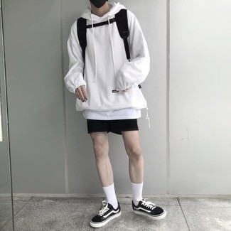 Sports Shorts Outfits For Men: Extremely stylish and comfortable, this pairing of a white hoodie and sports shorts provides with wonderful styling possibilities. Finishing with a pair of black and white canvas low top sneakers is a surefire way to breathe a sense of sophistication into your look.