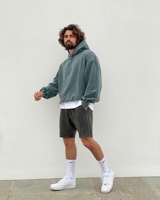 Silver Shorts Outfits For Men: If you like relaxed dressing, consider wearing a teal hoodie and silver shorts. White leather low top sneakers look amazing here.