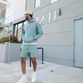 Mint Shorts Outfits For Men: A mint hoodie and mint shorts are the kind of a never-failing casual outfit that you so awfully need when you have zero time to plan out an outfit. If you wish to immediately dial down this getup with footwear, why not complement your outfit with white athletic shoes?