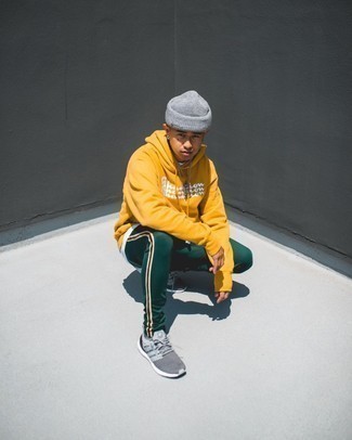 Mustard Print Hoodie Outfits For Men: Showcase your chops in men's fashion by teaming a mustard print hoodie and dark green sweatpants for a contemporary combination. If you're clueless about how to finish, a pair of grey athletic shoes is a never-failing option.