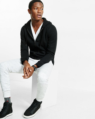 White Sweatpants Outfits For Men: A black hoodie and white sweatpants are essential in any modern gent's functional off-duty sartorial arsenal. Complete this outfit with a pair of black suede high top sneakers and ta-da: the look is complete.