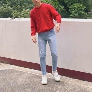 Light Blue Jeans Outfits For Men: For an off-duty outfit with a modernized spin, go for a red hoodie and light blue jeans. Look at how nice this outfit is rounded off with white canvas low top sneakers.