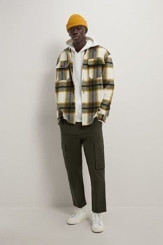 Olive Plaid Flannel Long Sleeve Shirt Outfits For Men: Marrying an olive plaid flannel long sleeve shirt with olive cargo pants is an on-point idea for an off-duty outfit. Switch up this look by rounding off with white canvas high top sneakers.