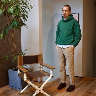 Dark Green Hoodie Outfits For Men: This relaxed combination of a dark green hoodie and khaki chinos couldn't possibly come across other than incredibly sharp. Introduce dark brown suede desert boots to your ensemble for an instant style fix.
