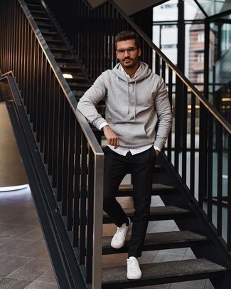 Grey Hoodie Outfits For Men: You'll be surprised at how very easy it is for any man to pull together this casual look. Just a grey hoodie teamed with black chinos. If in doubt as to what to wear in the footwear department, introduce a pair of white canvas low top sneakers to the equation.