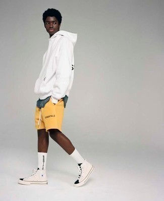 White and Black Canvas High Top Sneakers Outfits For Men: For something more on the relaxed end, opt for a white and black print hoodie and mustard sports shorts. And if you need to instantly bump up your outfit with shoes, complete your ensemble with white and black canvas high top sneakers.