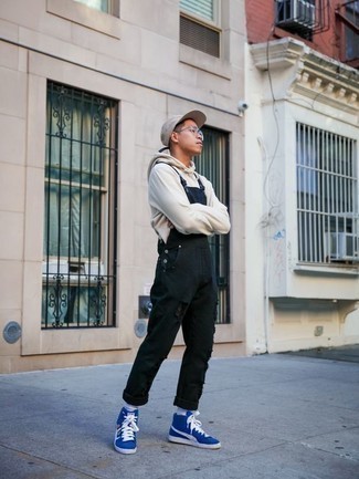 Overalls with Hoodie Outfits For Men: This combination of a hoodie and overalls is solid proof that a simple off-duty outfit doesn't have to be boring. Let your outfit coordination savvy truly shine by complementing your getup with blue canvas high top sneakers.