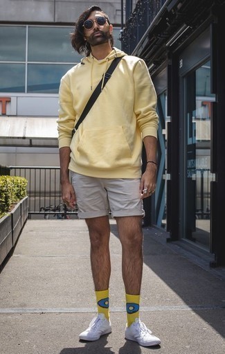 Men's Yellow Hoodie, Beige Shorts, White Canvas Low Top Sneakers, Black Sunglasses