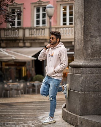 Tan Print Hoodie Outfits For Men: If you’re a jeans-and-a-tee kind of guy, you'll like this simple but cool and casual combination of a tan print hoodie and blue ripped skinny jeans. White and black athletic shoes will be the perfect companion for your ensemble.