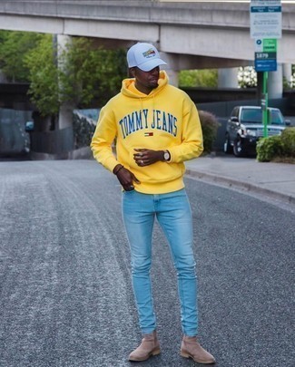 White and Black Print Baseball Cap Outfits For Men: Marry a yellow print hoodie with a white and black print baseball cap for an unexpectedly cool ensemble. Don't know how to complement your outfit? Wear a pair of tan suede chelsea boots to polish it off.