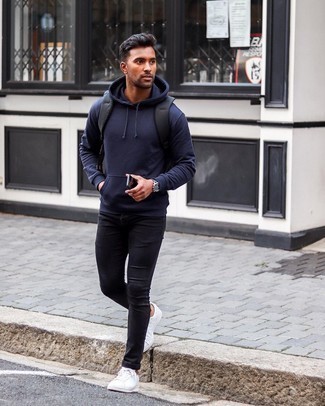 Navy Hoodie Outfits For Men: If you're hunting for a contemporary but also stylish getup, opt for a navy hoodie and black skinny jeans. To introduce a little classiness to this look, add a pair of white leather low top sneakers to the equation.
