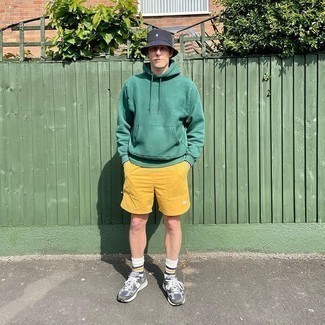 Mustard Sports Shorts Outfits For Men: Why not dress in a green hoodie and mustard sports shorts? As well as very practical, both of these items look awesome when worn together. Grey athletic shoes are the ideal accompaniment for your outfit.
