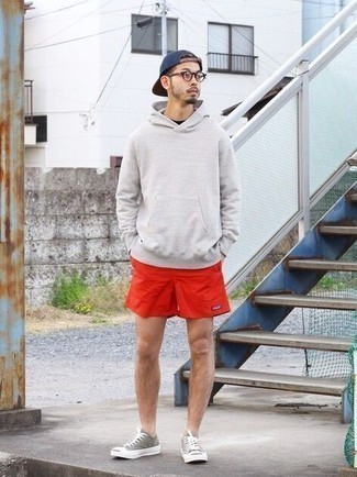 500+ Relaxed Fall Outfits For Men: A grey hoodie and red sports shorts are a great combination to have in your daily casual repertoire. Wondering how to finish your outfit? Rock grey canvas low top sneakers to spruce it up. It's a wonderful idea if you're picking out a well-coordinated look for unpredictable fall weather.
