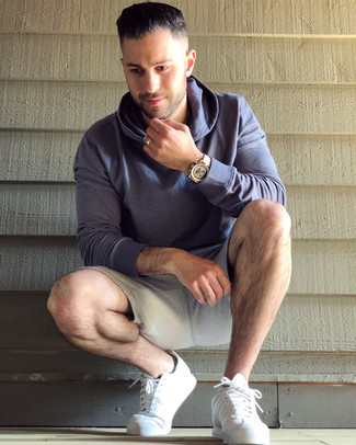 Grey Sports Shorts Outfits For Men: If you want to look stylish and remain comfortable, go for a violet hoodie and grey sports shorts. Flaunt your classy side by finishing with white leather low top sneakers.